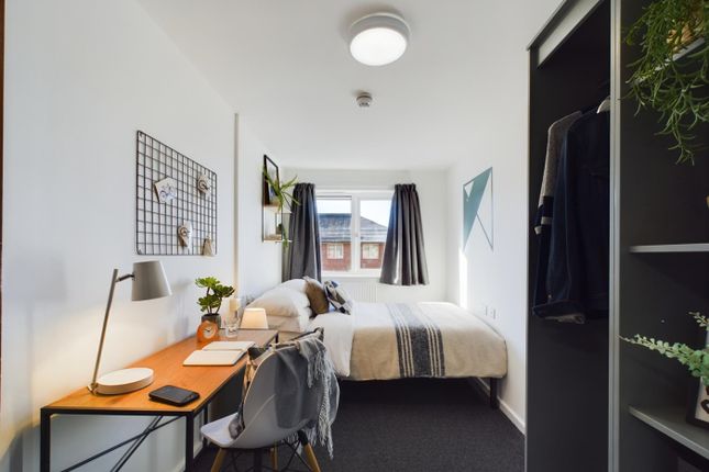 A Bright And Inviting Double Bedroom Featuring A c...