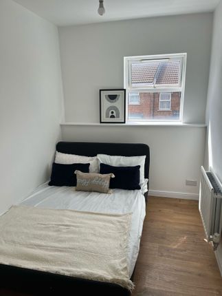 A Cozy Double Bedroom Featuring A Comfortable Bed ...