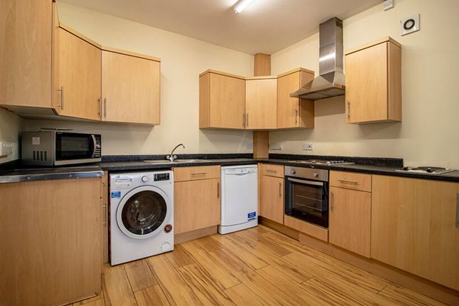 This Modern Kitchen Features Ample Storage With Sl...