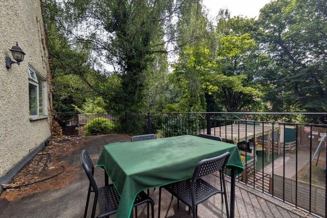 A Peaceful Garden Terrace With Outdoor Seating Sur...