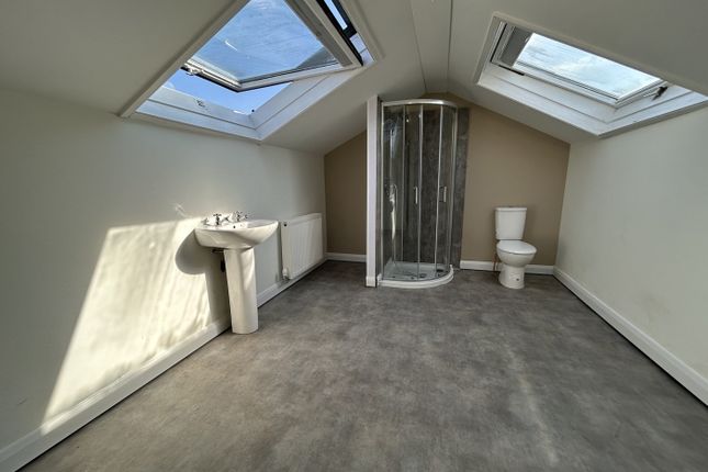 A Spacious And Bright Bathroom Featuring Modern fi...