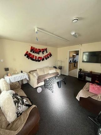 Bright Communal Living Room With Comfortable Sofas...