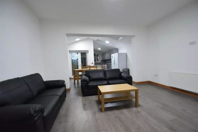 Spacious And Modern Living Room Featuring Comforta...
