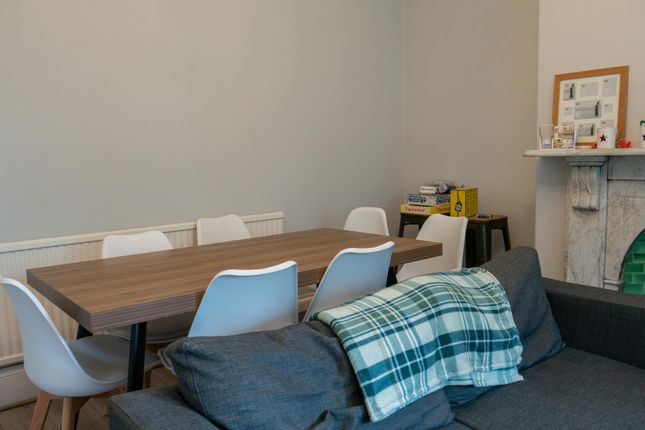 A Welcoming Living Room Featuring Comfortable Seat...