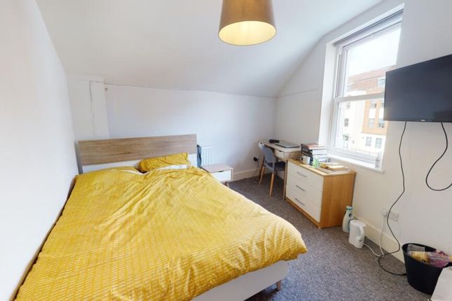 This Cozy Double Bedroom Features A Bright Atmosph...