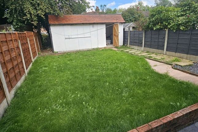 A Beautifully Maintained Garden Featuring A Spacio...
