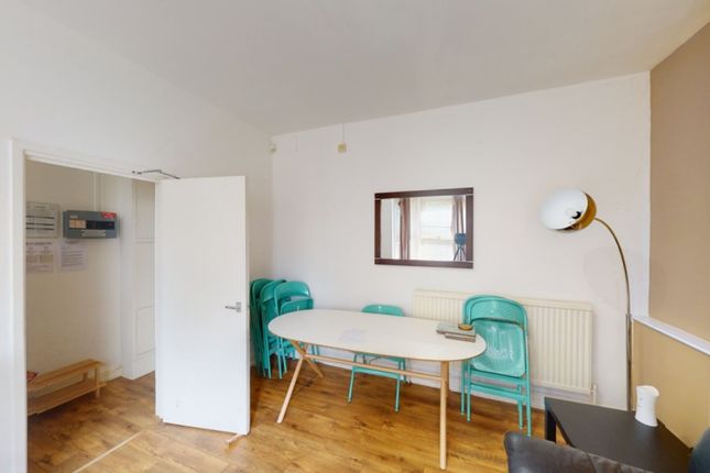 A Bright And Inviting Living Room Perfect For Soci...