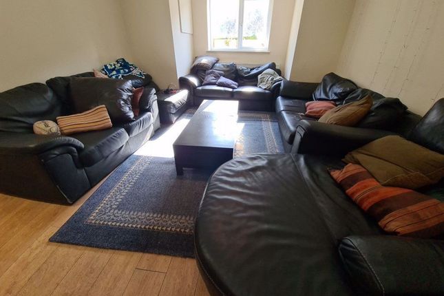 A Spacious, Contemporary Living Room Featuring Mul...