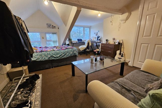 A Spacious And Cozy Living Room With Large Windows...