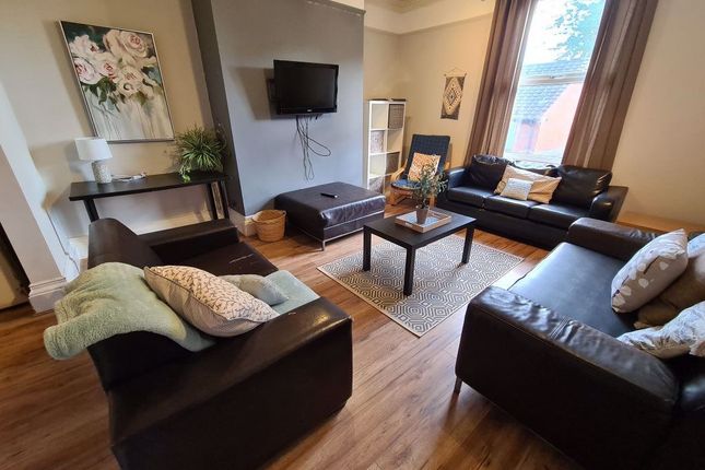 A Contemporary Living Room Featuring Dark Leather ...