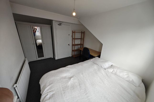 A Cozy Double Bedroom Featuring A Comfortable Bed ...