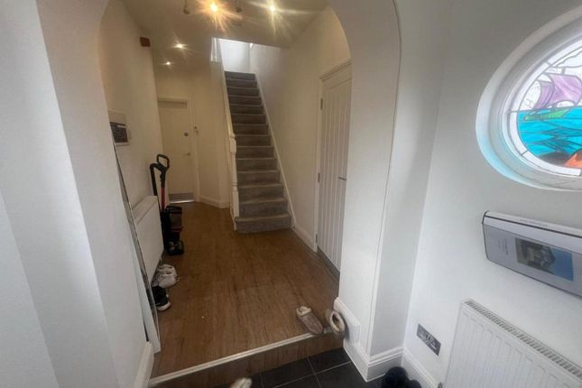 A Spacious And Bright Hallway With Stylish Feature...