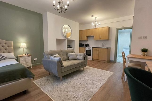 A Spacious And Stylish Large Modern Living Room Fe...