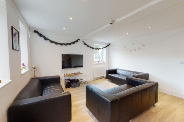A Bright And Inviting Living Room Featuring Stylis...