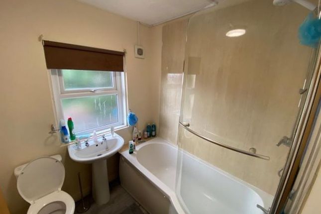 Bright And Clean Bathroom Featuring A Modern Batht...