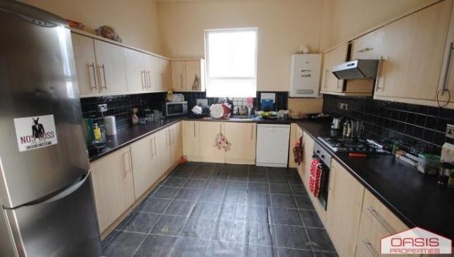 A Modern And Well-Maintained Kitchen With Ample Co...