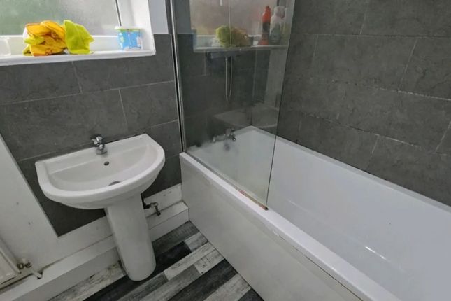 A Modern Bathroom Featuring A Stylish Bathtub And ...