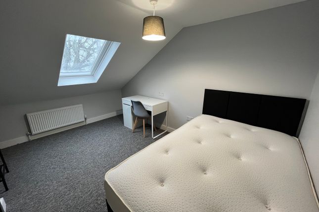 A Spacious And Inviting Double Bedroom With A Mode...