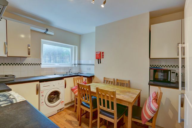 A Bright And Well-Lit Kitchen Area Featuring A Din...
