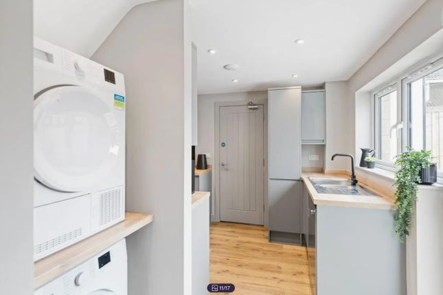 A Modern And Well-Equipped Kitchenette With Ample ...