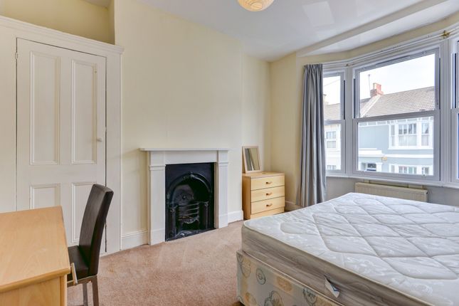Bright Master Bedroom Featuring A Large Bay Window...