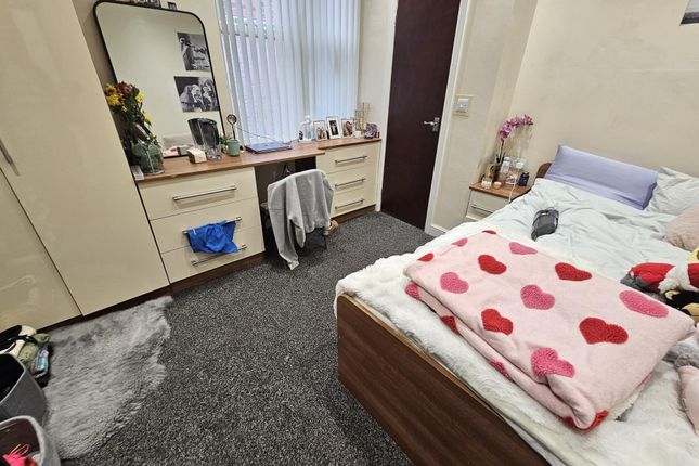 A Spacious And Inviting Master Bedroom Featuring A...