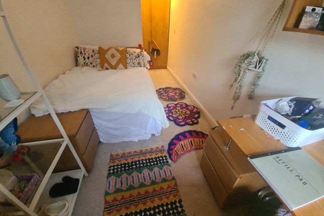 Cozy Single Bedroom Featuring A Comfortable Bed Wi...