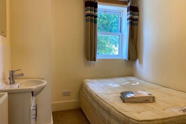 A Clean And Well-Maintained Bathroom With A Large ...