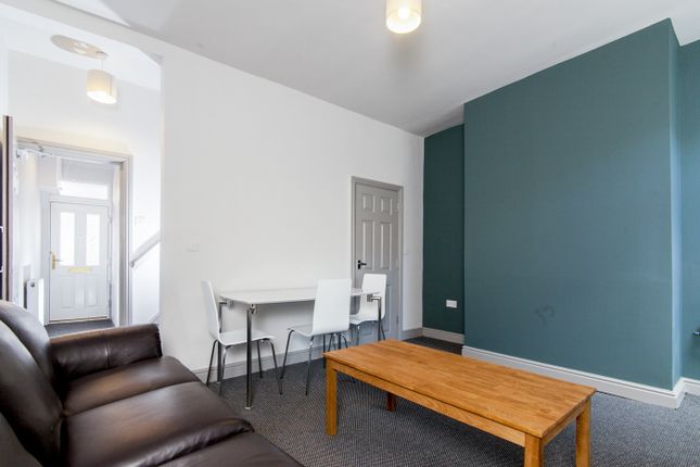 Spacious And Inviting Living Room Featuring Comfor...