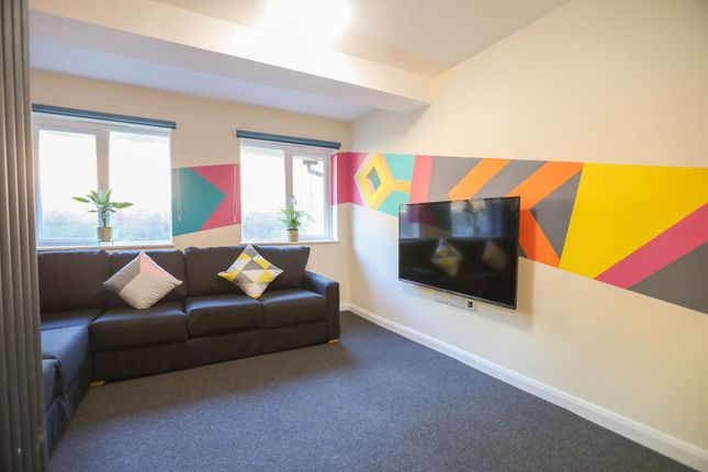 Experience A Vibrant Living Room Adorned With Colo...