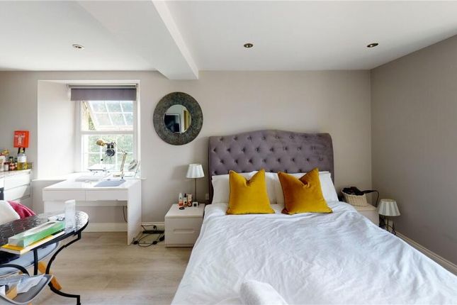 Bright And Inviting Master Bedroom Featuring A Com...