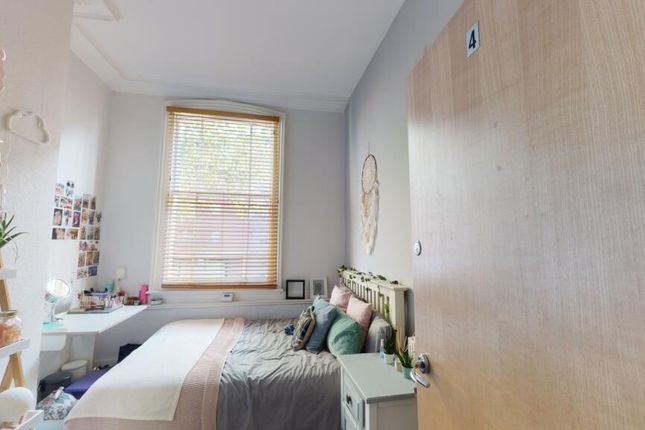 A Bright And Tidy Double Bedroom Featuring A Comfo...