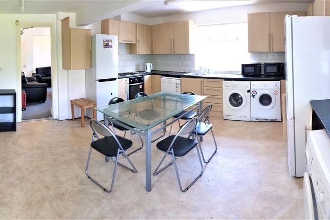 Bright And Spacious Kitchen Featuring Modern Appli...