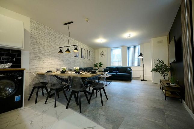 A Modern And Stylish Living Room Featuring A Spaci...