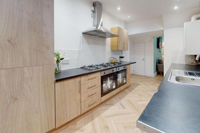 A Modern And Spacious Kitchen With Ample Storage A...