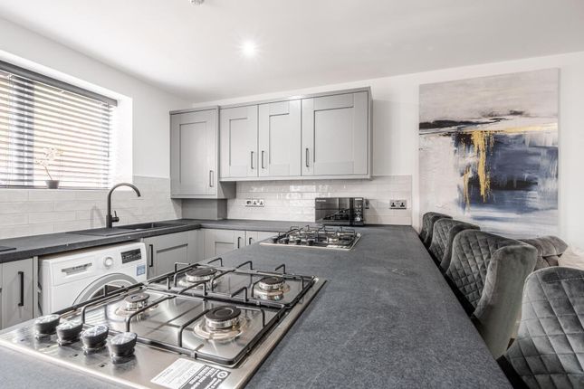 Modern And Well-Maintained Kitchen Featuring Sleek...