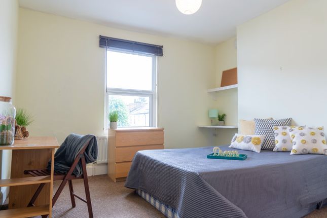 A Bright And Inviting Double Bedroom Featuring A c...