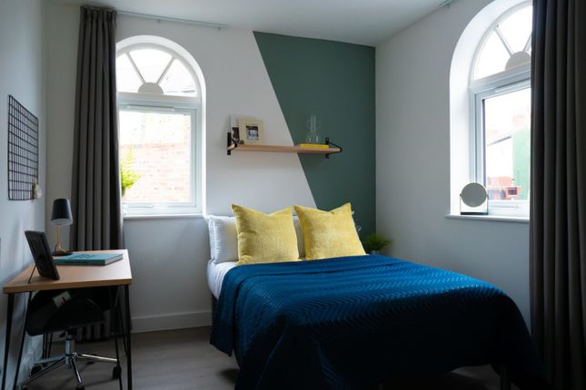 A Stylish And Well-Lit Double Bedroom Featuring Co...