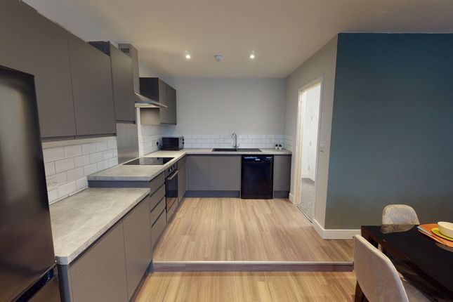 A Modern And Clean Kitchenette Featuring Stylish c...