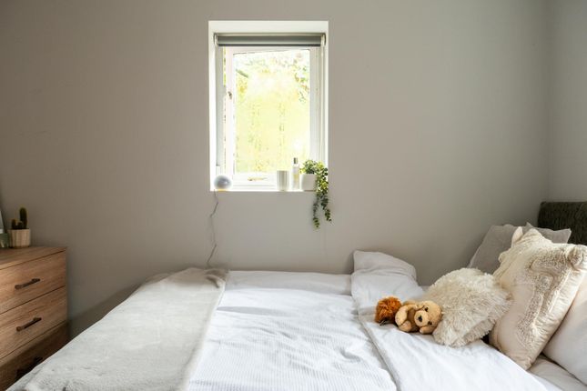 A Bright And Welcoming Master Bedroom Featuring A ...