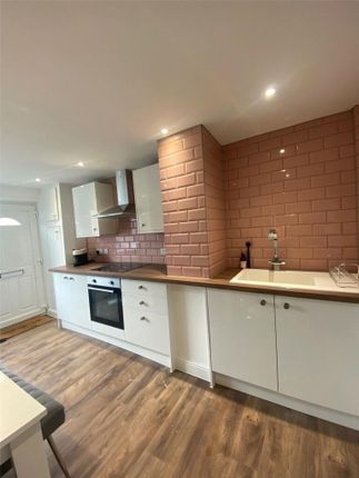A Modern, Well-Maintained Kitchen Featuring White ...