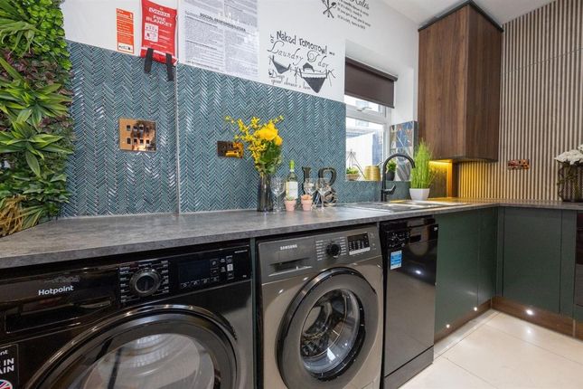 A Modern Kitchen Featuring Sleek Cabinetry And A S...