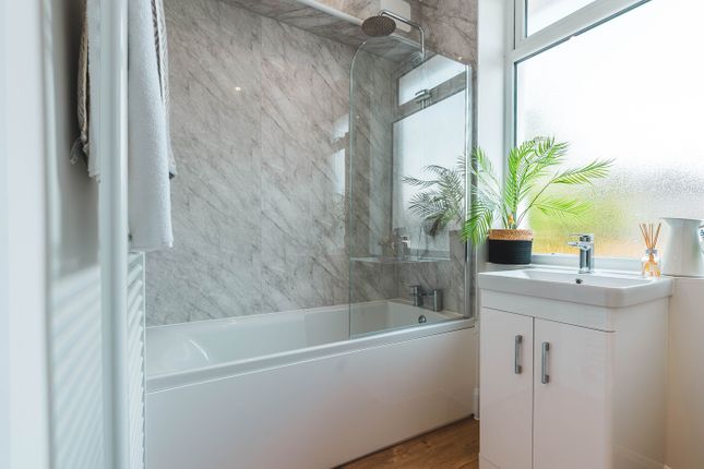 A Beautifully Designed Bathroom Featuring A Modern...