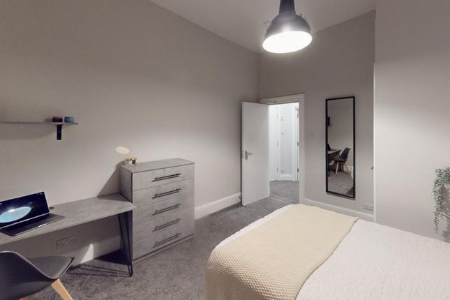 A Stylish And Spacious Double Bedroom Featuring A ...