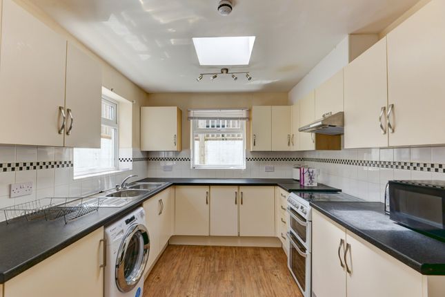 A Bright, Well-Maintained Kitchen Featuring Modern...