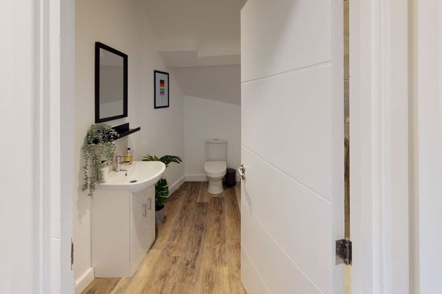 A Modern And Clean Bathroom Featuring Stylish Fixt...