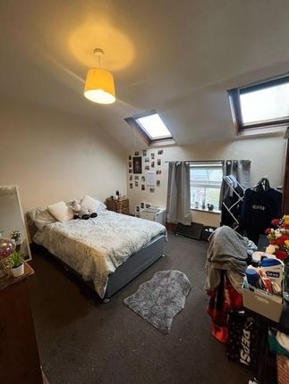 A Cozy Bedroom Featuring A Double Bed, With Natura...