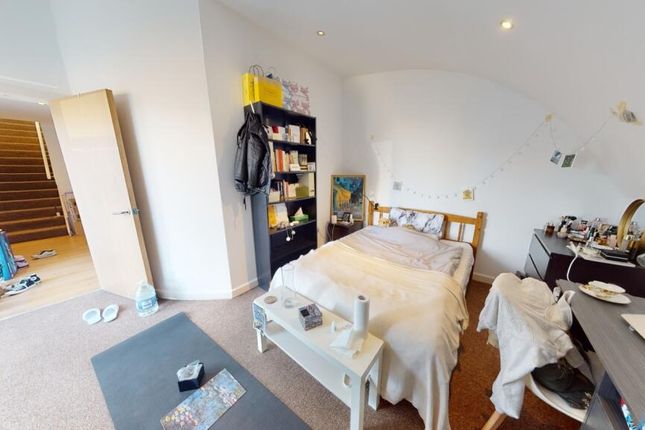 A Spacious, Bright Master Bedroom Featuring A Comf...