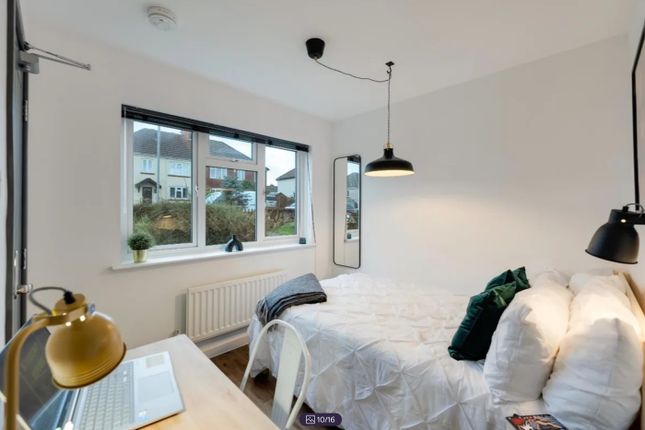 A Bright And Inviting Double Bedroom Featuring Lar...