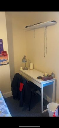 This Cozy Double Bedroom Features A Comfortable Be...